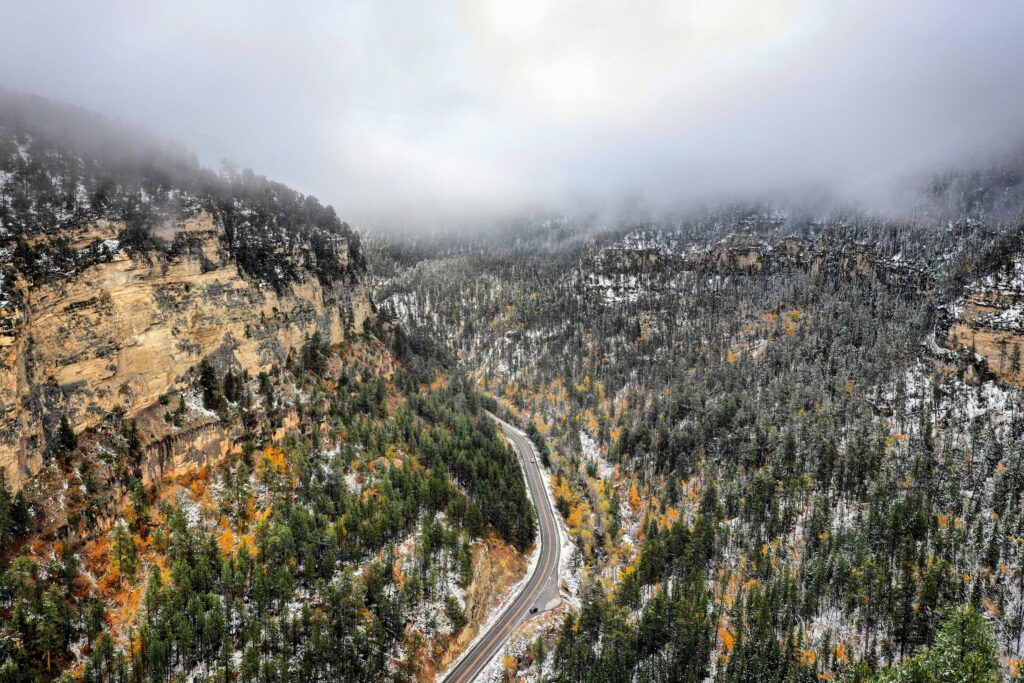 pexels-photo-1625181-1625181 A breathtaking view of Spearfish Canyon with snow-covered trees and rocky cliffs during winter.