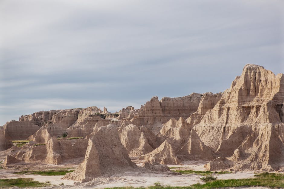 pexels-photo-4671878-4671878 Explore the dramatic rock formations in the Badlands under a clear sky, showcasing nature's artistry.
