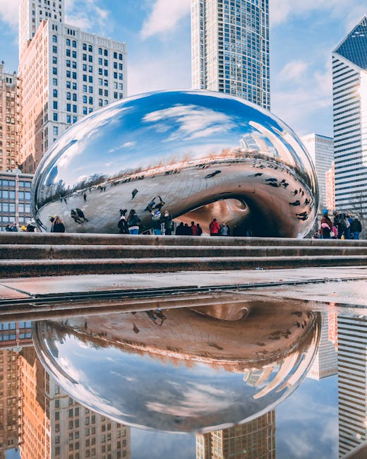 Stunning reflection of Cloud Gate sculpture, known as The Bean, in downtown Chicago's Millennium Park.